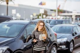 Woman renting a car at London Heathrow Airport