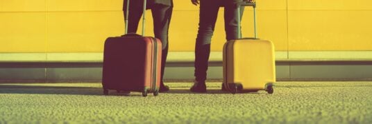 Tourists waiting for an airport transfer to their hotel.